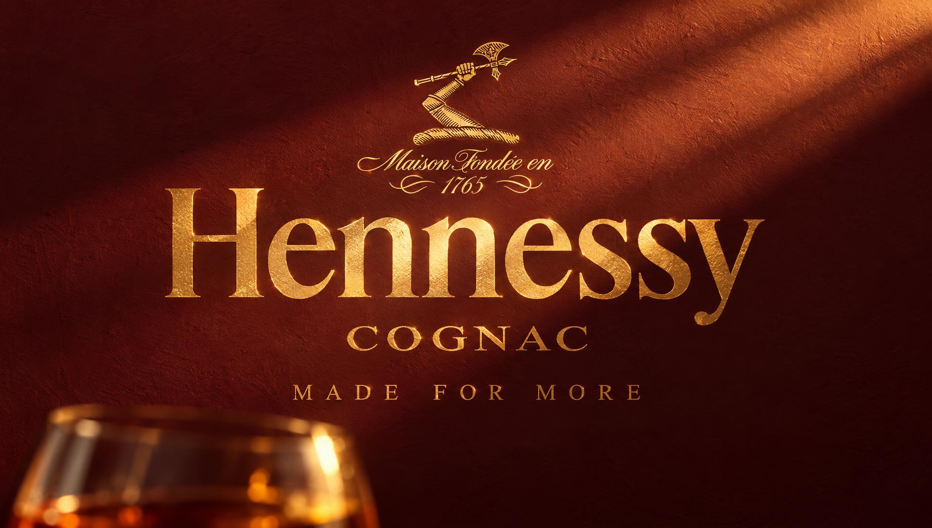 Hennessy end card in golden light on an oxblood wall