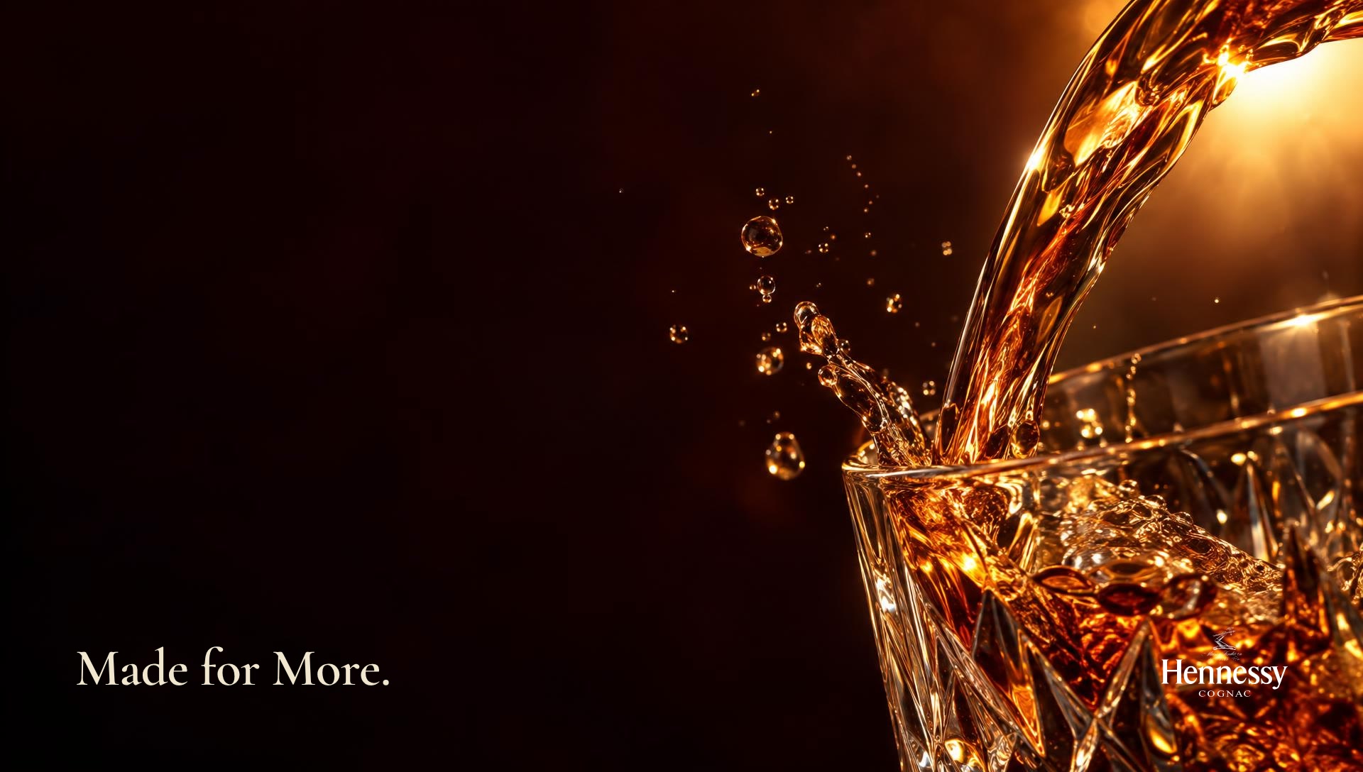 A ribbon of cognac pouring into a crystal glass